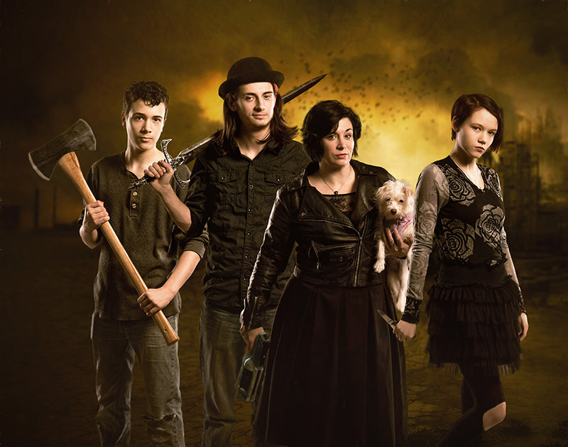 A creative family photo with weapons.